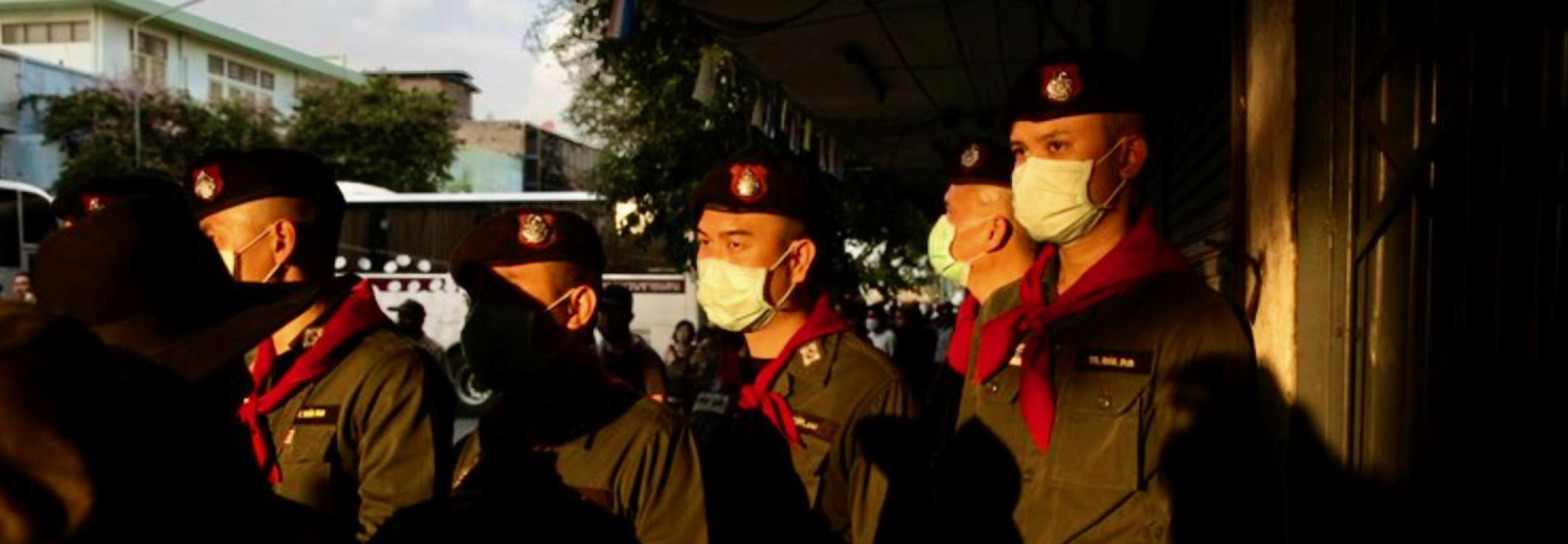 Thai police officers in the afternoon sun